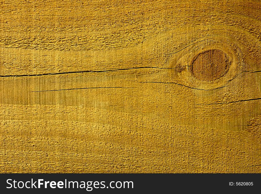 Close-up of a pine plank with a knot in it. Close-up of a pine plank with a knot in it.