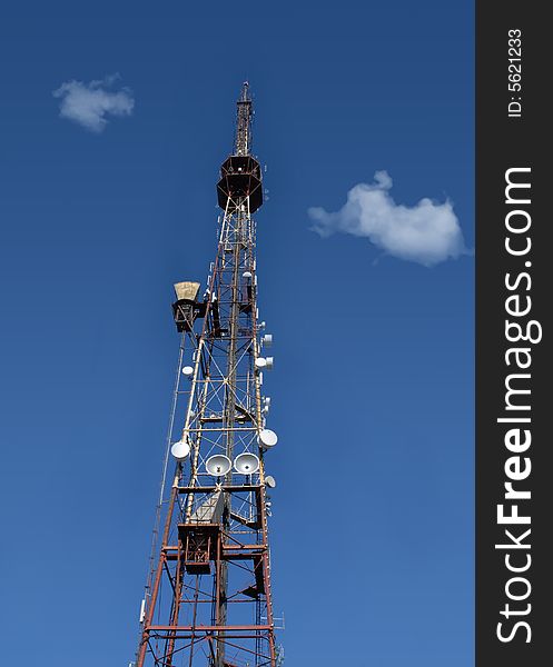 Television tower on the blue sky background