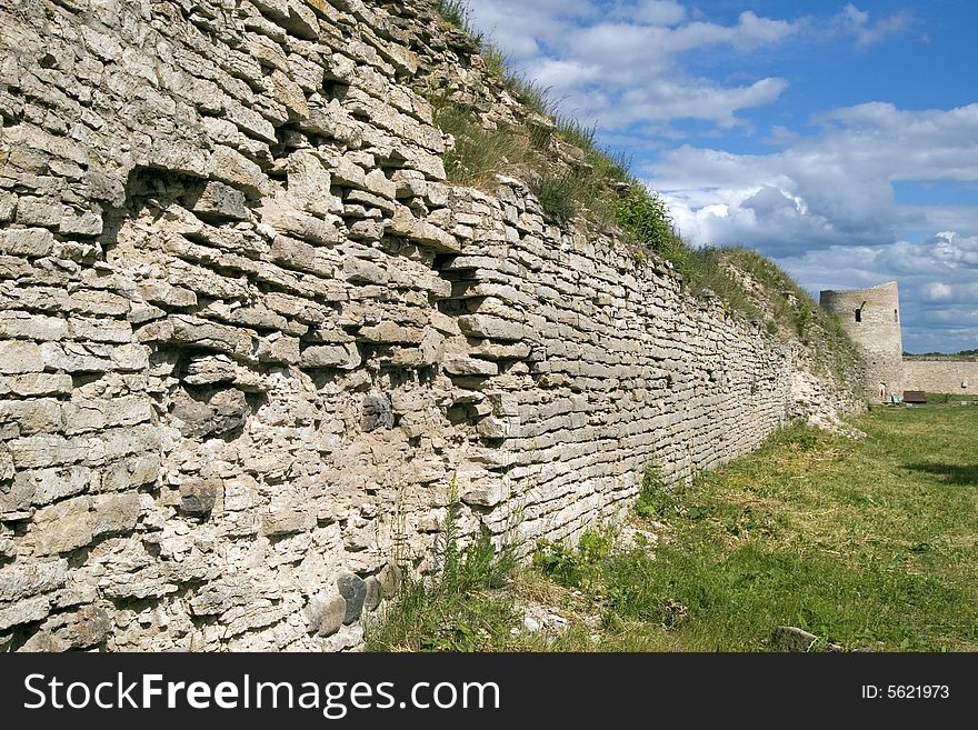 Old fortification wall  with a grass, Izbork, Pskov region, Russia, XI century