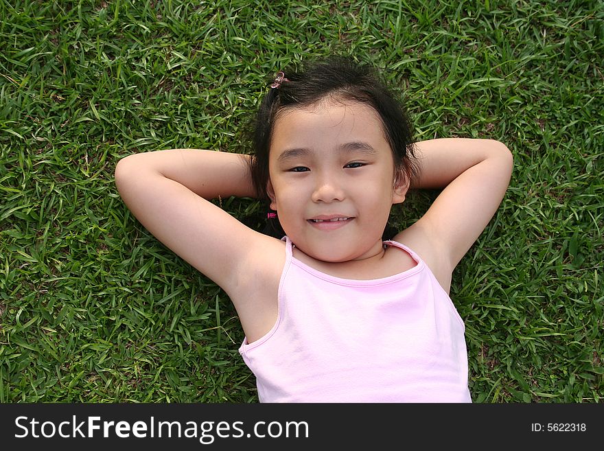 Girl lying on the grass