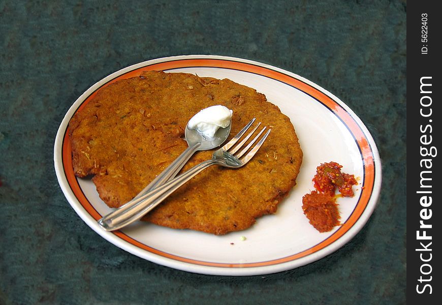 A tasty dish of Indian crusine with butter on top