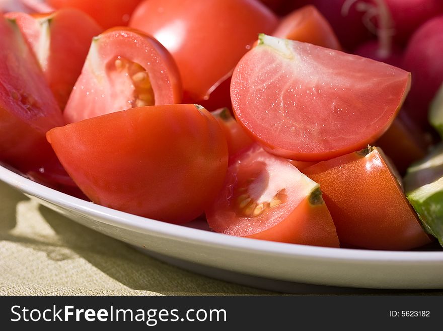 Food series: red fresh and ripe sliced tomatoes