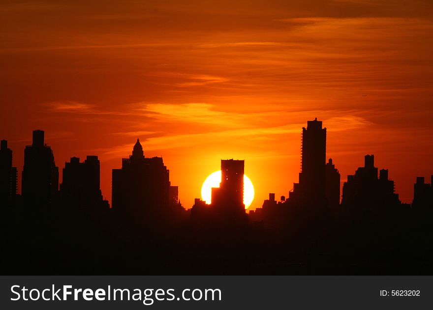 Silhouette of Manhattan highrises at sunset. Silhouette of Manhattan highrises at sunset.