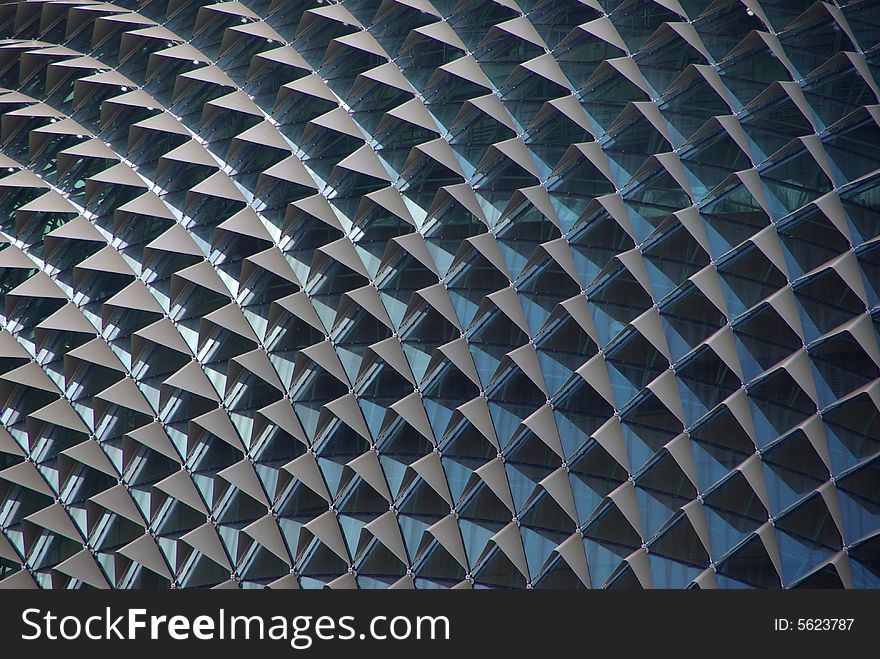 An abstract view of the aluminium sun shades, shielding the glass of the Esplanade Theatres. The Esplanade - Theatres on the Bay, Singapore. An abstract view of the aluminium sun shades, shielding the glass of the Esplanade Theatres. The Esplanade - Theatres on the Bay, Singapore.