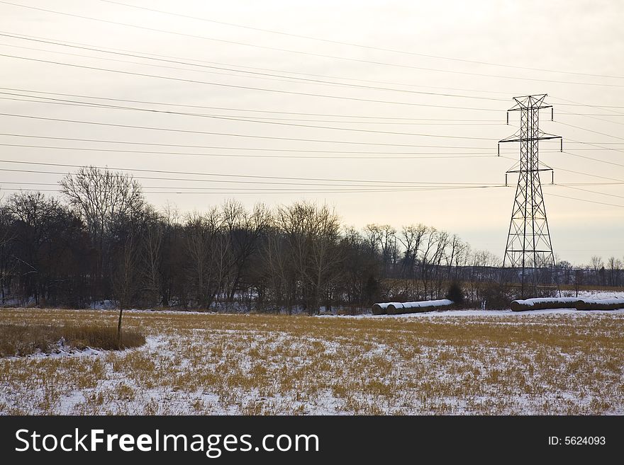 Power lines over winter farm fields. Power lines over winter farm fields