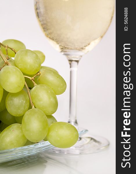 Glass of white wine and grapes. Glass of white wine and grapes.