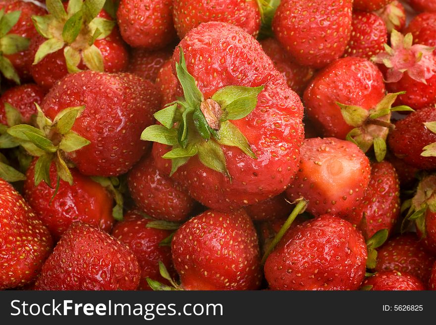 Fresh picked strawberries filling the image frame