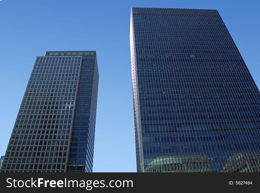 Two skyscrapers with a clear sky background. Two skyscrapers with a clear sky background