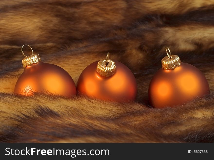 Christmas golden balls on a fur. Christmas golden balls on a fur