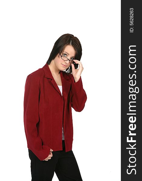 Young woman in business casual attire, looking over the top of her glasses