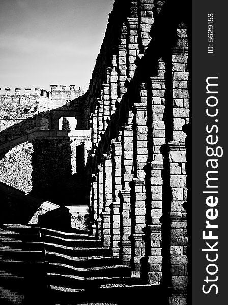 Archways with cascading shadows in black and white and shot at a dramatic angle. Archways with cascading shadows in black and white and shot at a dramatic angle.