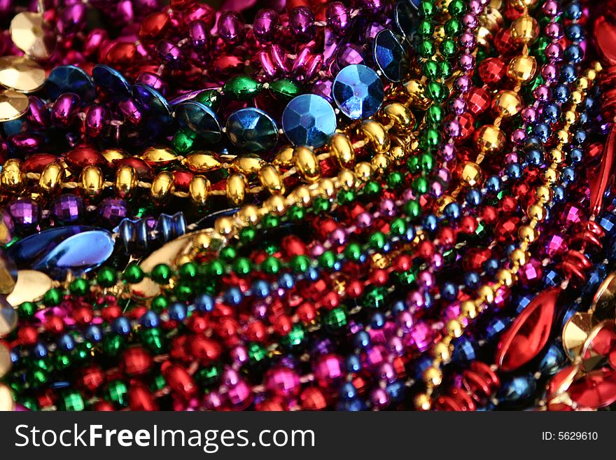 A background image of strings of colorful beads.