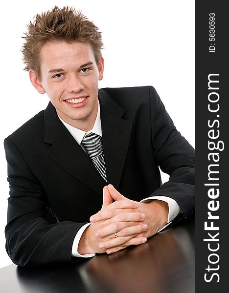 A young businessman sitting in his office