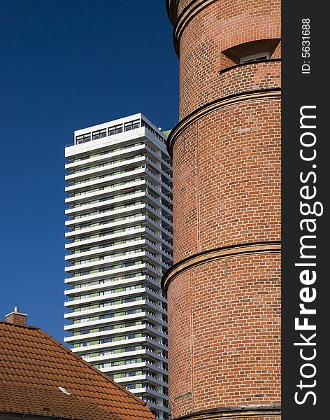 Lighthouse and skyscraper in travemuende, germany