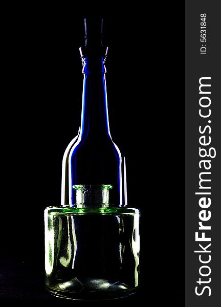 An image of bottles on black background. An image of bottles on black background