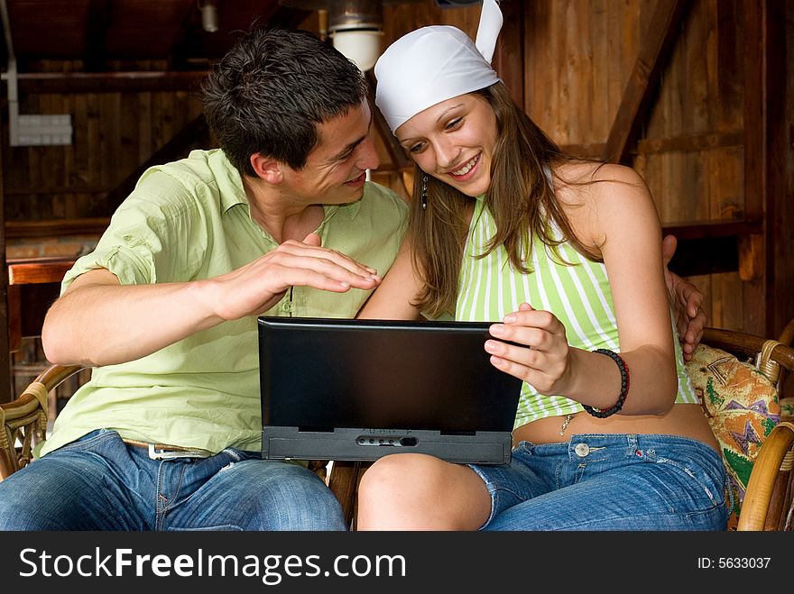 Young man and woman making internet searching. Young man and woman making internet searching
