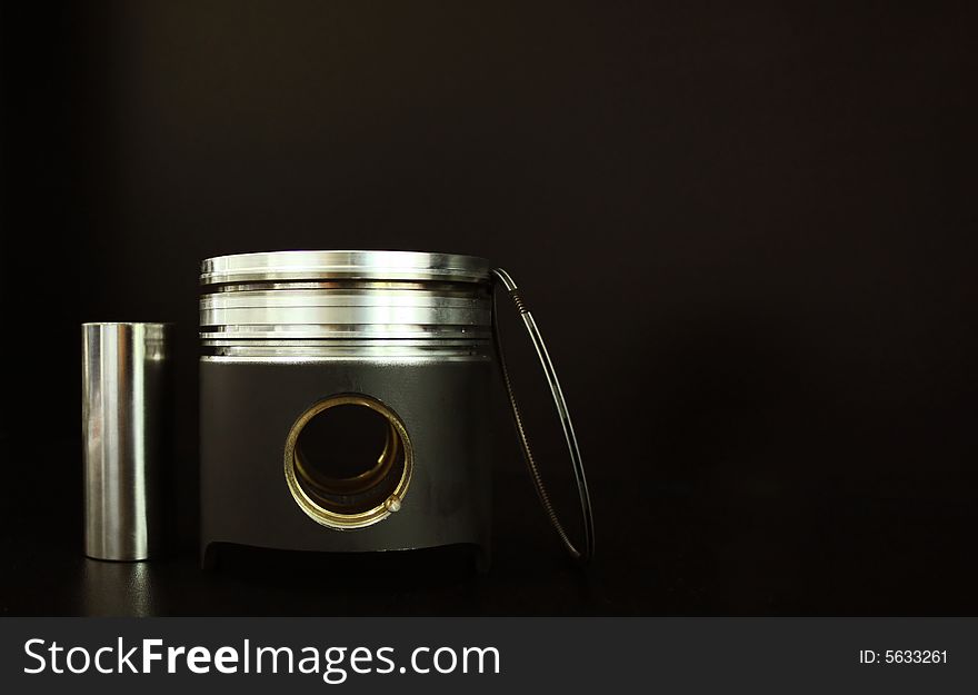 Liner, piston and valves isolated on black. Liner, piston and valves isolated on black