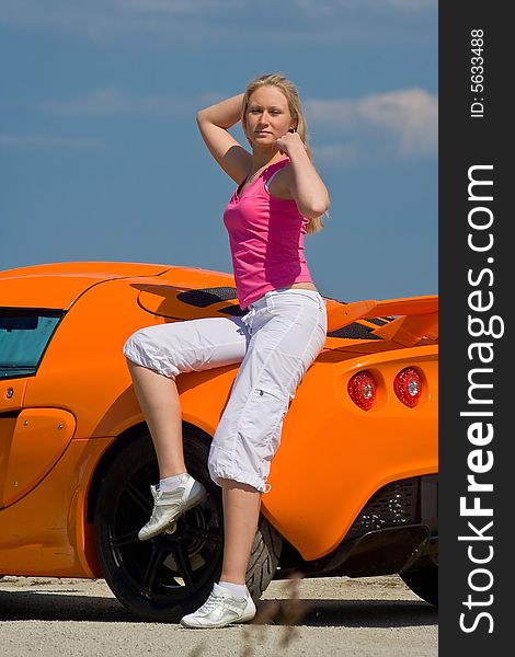 Girl Standing Next To A Car