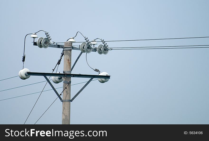 This is the close-up of a unit of electrical wire and pole. This is the close-up of a unit of electrical wire and pole.
