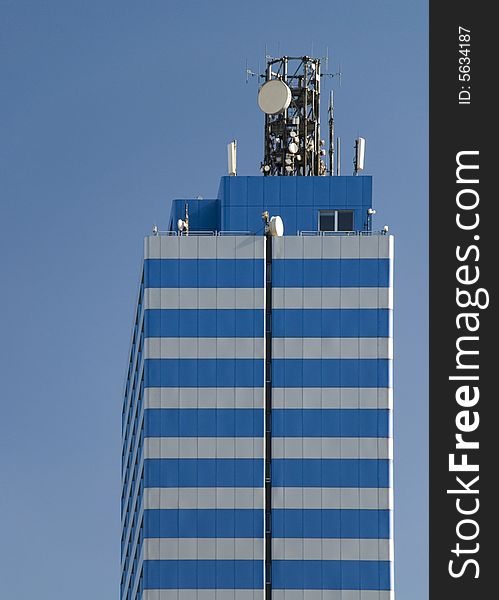 A skyscraper in the blue sky