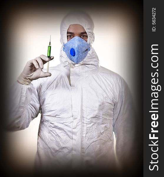 Man wear protechion clothes and hol syringe background