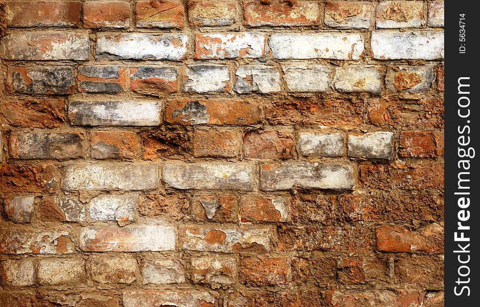 Fragment of old brick wall with gray stucco. Fragment of old brick wall with gray stucco
