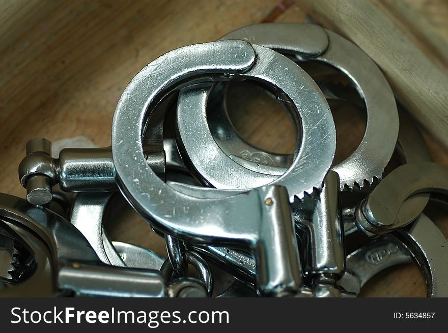 Some handcuffs in a wood box.