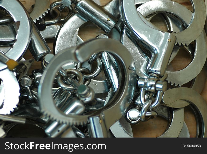 Some handcuffs in a wood box.