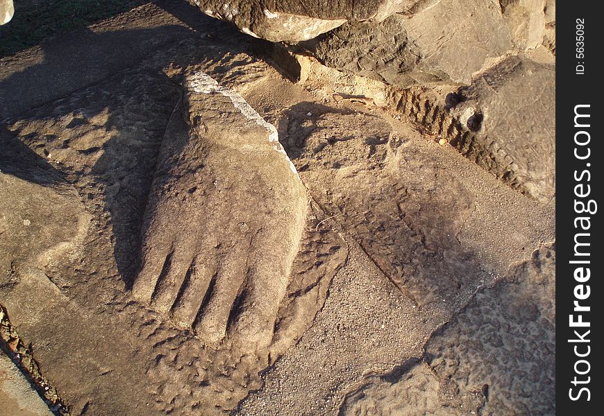 A broken foot is all that is left of a stolen statue.