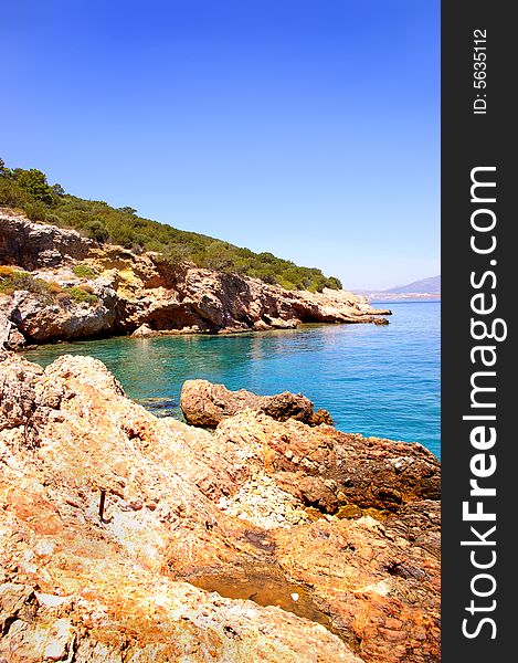 Pictorial torquoise lagoon with rocky beach. Pictorial torquoise lagoon with rocky beach