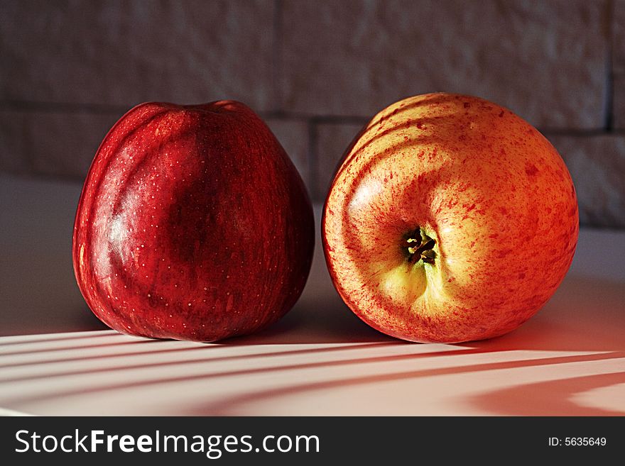Two apples on a sunlight