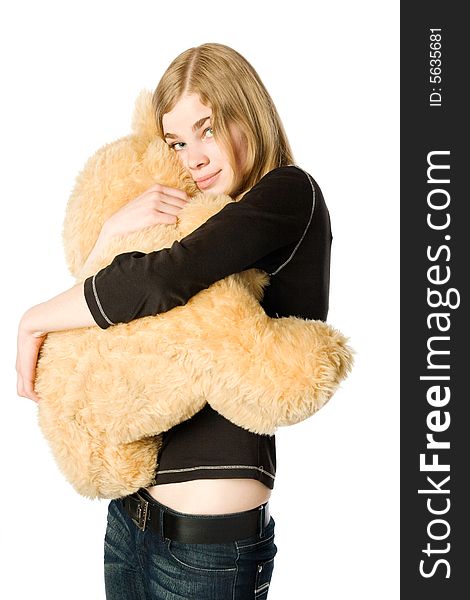 Young girl hugging a Teddy bear, isolated. Young girl hugging a Teddy bear, isolated