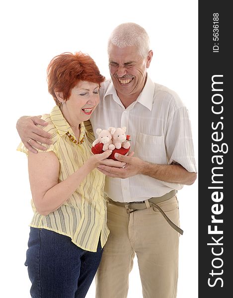 Seniou couple with toy in studio on white background. Seniou couple with toy in studio on white background