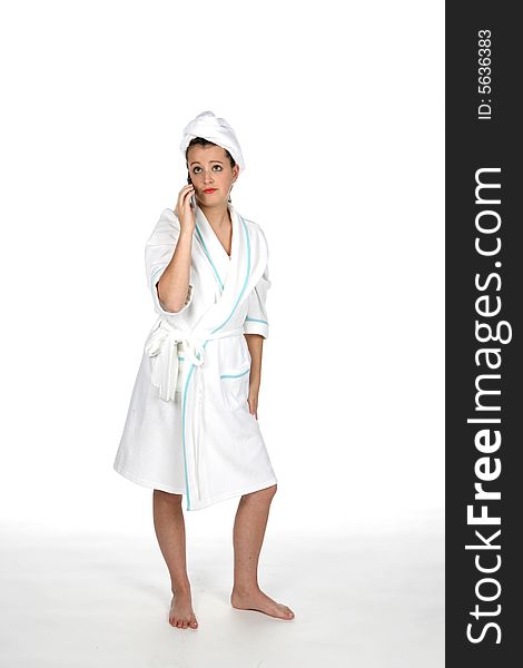 Teen in robe and hair towel talking on the phone. Teen in robe and hair towel talking on the phone