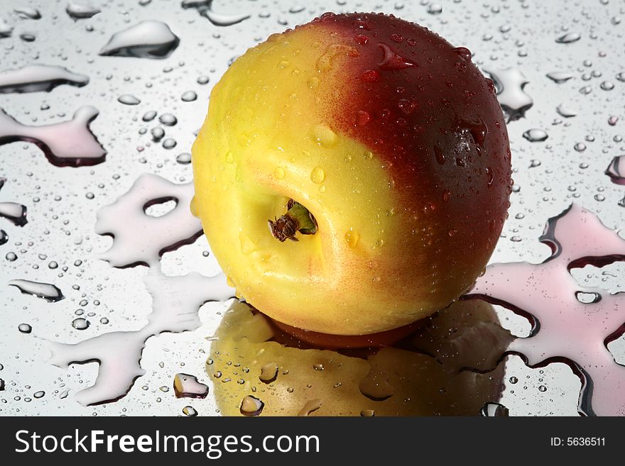 Big ripe nectarine with water's drops