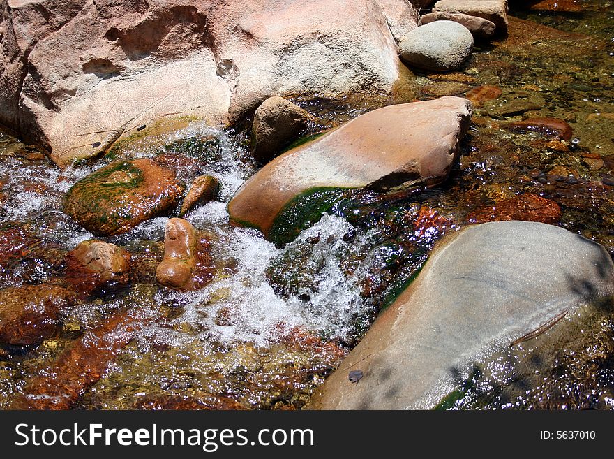 Water running through rocks on a river. Water running through rocks on a river