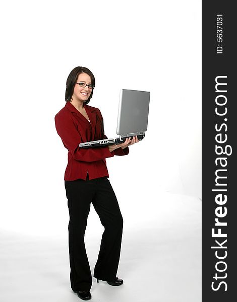 Laptop being held b a teenage girl in a casual business suit. Laptop being held b a teenage girl in a casual business suit