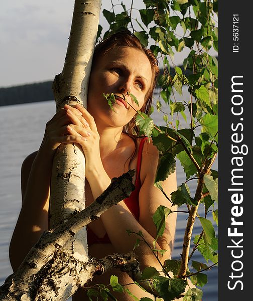Woman Smile by Tree and Leaves in Water. Woman Smile by Tree and Leaves in Water