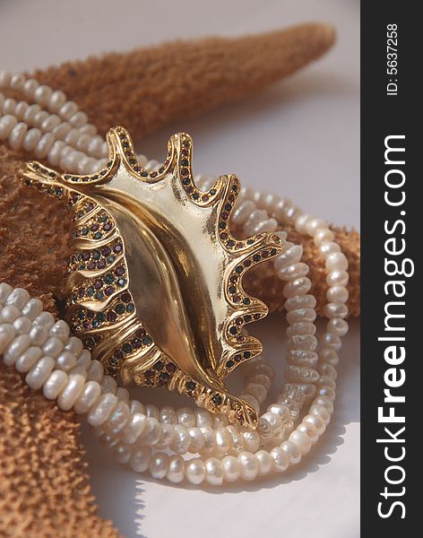 Sea conch, starfish and pearls necklace. Sea conch, starfish and pearls necklace