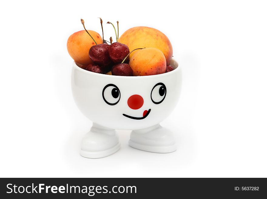 Bowl with smiling face filled with fruits. Bowl with smiling face filled with fruits
