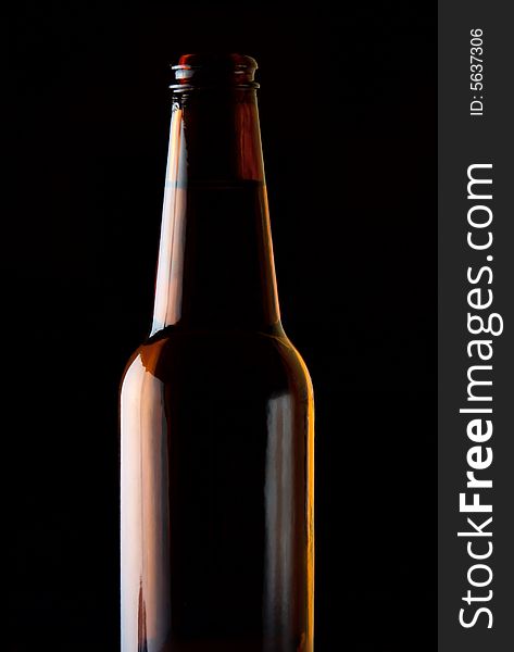 One bottle of beer isolated on black