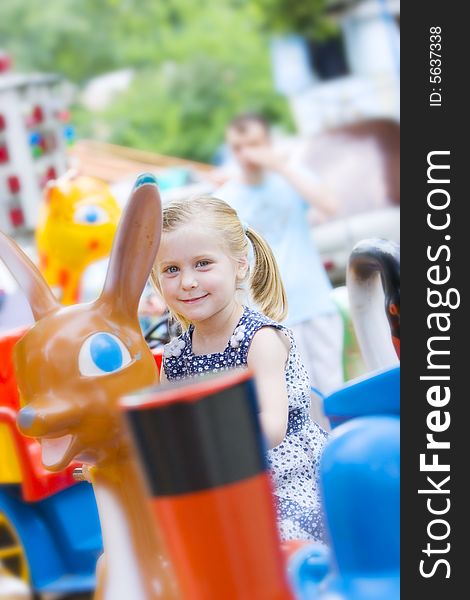 Little cute girl having fun in park