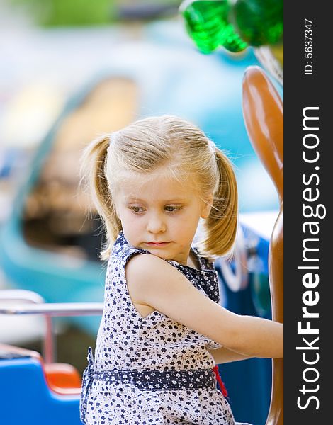 Little cute girl having fun in park