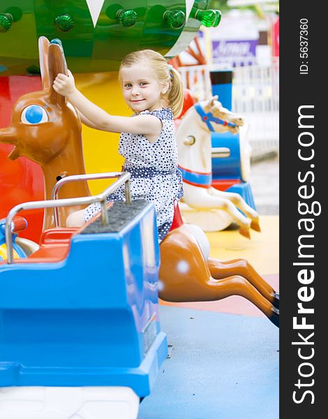 Little cute girl having fun in park