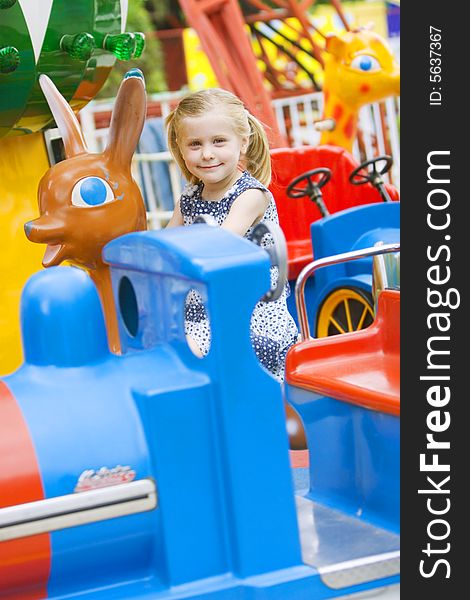 Little cute girl having fun in park