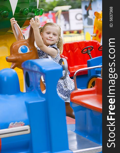 Little cute girl having fun in park