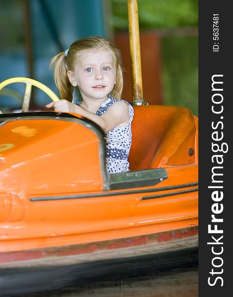 Little cute girl having fun in park