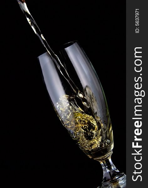 Glass of drink poured on black background. Glass of drink poured on black background