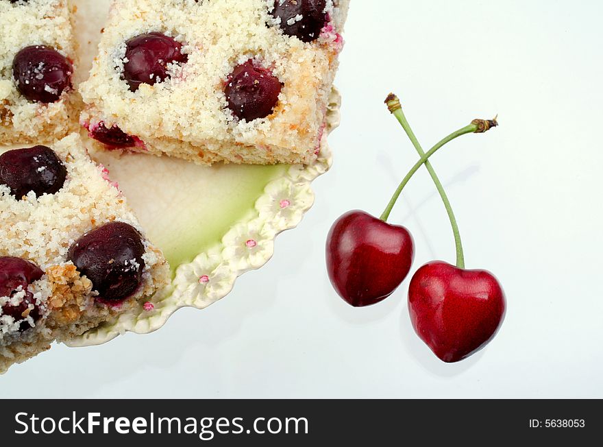 Homemade shortcake with cherries on white background. Homemade shortcake with cherries on white background