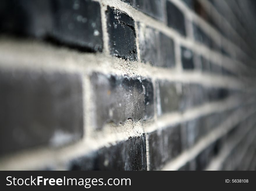 A black brick wall - it looks almost like a black and white photograph, but it is in fact color.